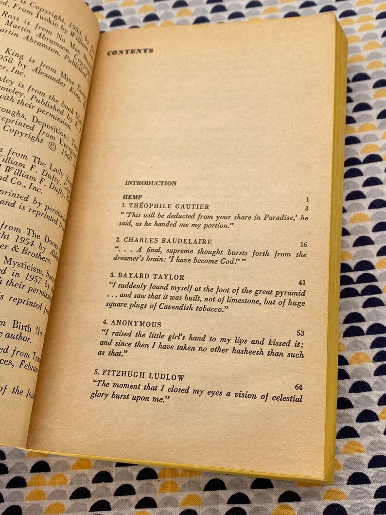 May include: A close-up of a yellowed page from a book with a table of contents and an introduction section. The text includes the title "Hemp" and the names of authors such as Theophile Gautier, Charles Baudelaire, Bayard Taylor, and Fitzhugh Ludlow.
