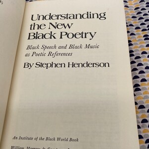 May include: A book titled "Understanding the New Black Poetry: Black Speech and Black Music as Poetic References" by Stephen Henderson. It is an Institute of the Black World Book published by William Morrow & Company, Inc. in New York in 1973.