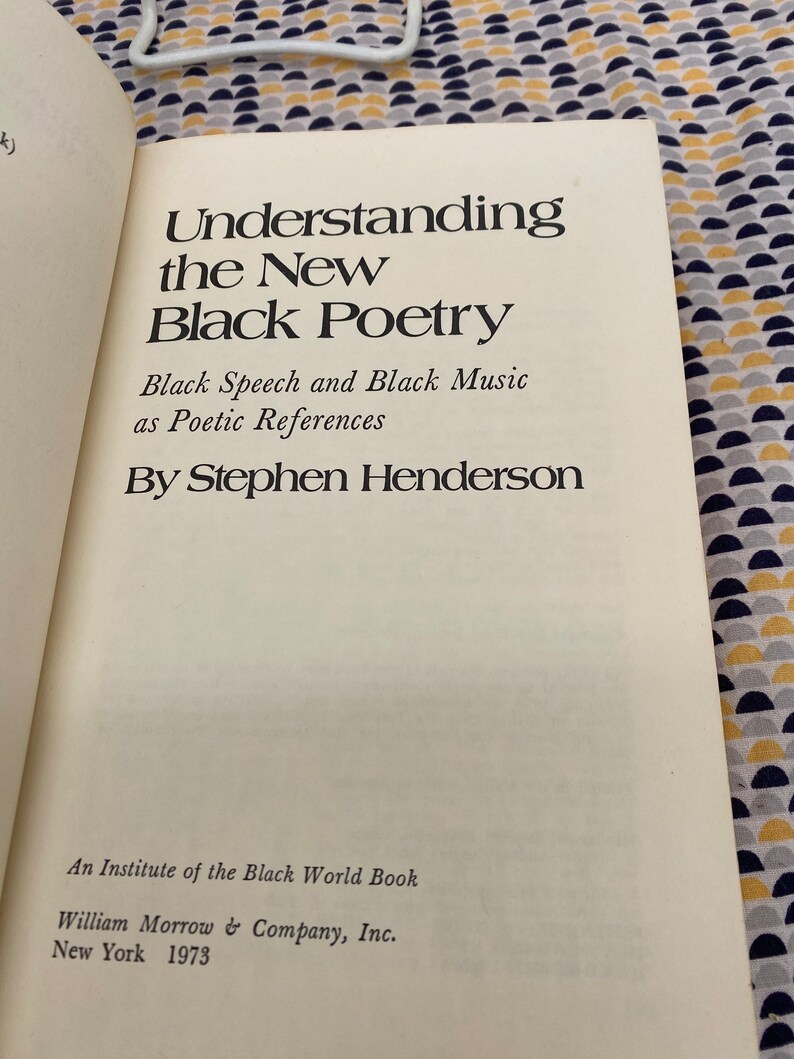 May include: A book titled "Understanding the New Black Poetry: Black Speech and Black Music as Poetic References" by Stephen Henderson. It is an Institute of the Black World Book published by William Morrow & Company, Inc. in New York in 1973.