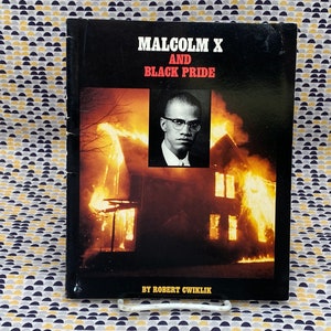May include: A black and white book cover with the title "Malcolm X and Black Pride" by Robert Cwiklik. The cover features a photo of Malcolm X in a white shirt and a burning house.