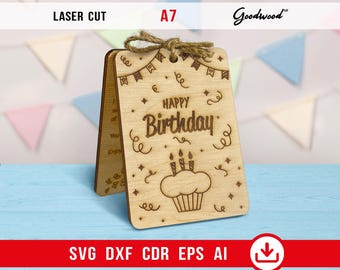May include: Laser-cut wooden birthday card with a cupcake design and the words "Happy Birthday." The card is tied with twine and includes the text "Laser Cut" and "A7."