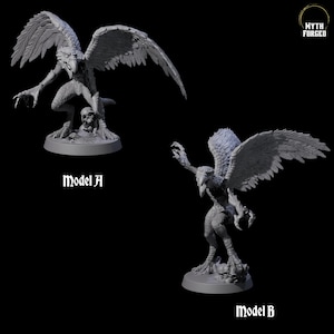 May include: Two gray, detailed fantasy creature models, labeled "Model A" and "Model B." Each figure has a bird-like head, feathered wings, and a humanoid body. Model A stands over a skull. The "Myth Forged" logo is in the upper right.