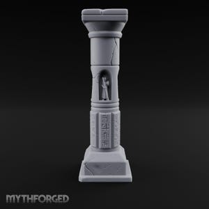 May include: A light grey, 3D-printed architectural column featuring a square base and capital, with a small recessed alcove containing a standing figure. The shaft displays vertical etched markings and weathered cracks throughout the structure.