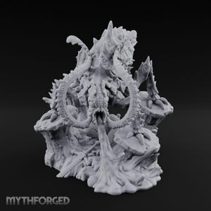 May include: A light grey resin miniature figure of a multi-limbed creature with large curved tusks, standing on a rocky base with a sword lying on the ground. The creature has a textured, spiky body and is positioned over a flowing liquid effect.