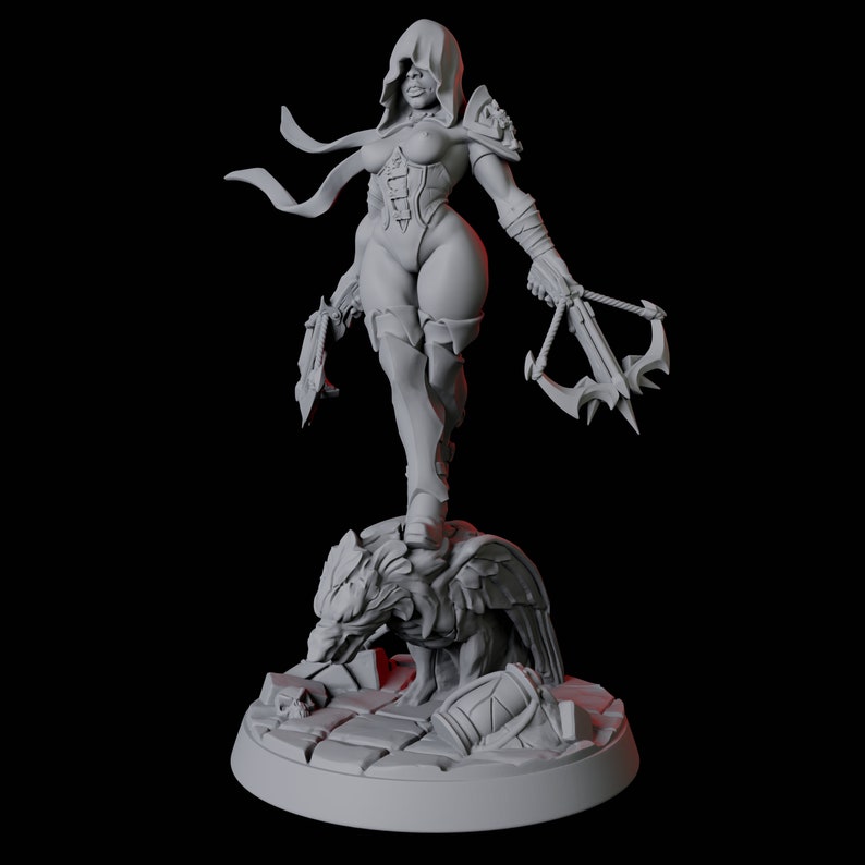 May include: A gray figurine of a female warrior in a hooded cloak, holding a crossbow and a blade. She stands atop a detailed sculpture of a creature, with a shield and other elements at the base. The figure is set against a dark background.
