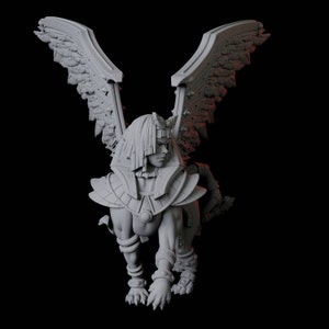 May include: A grey, sculpted figurine of a winged creature with a human head and a lion's body. The creature is wearing a detailed, decorative headdress and armour.