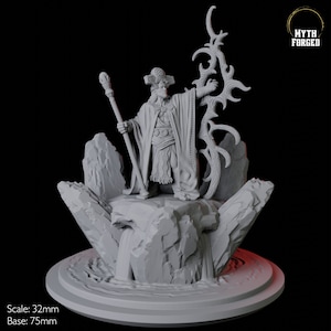 May include: A detailed 3D-printed miniature of a robed figure with a staff, standing on a rocky platform with a waterfall. The figure wears a detailed hat and ornate clothing. The base is 75mm in diameter.