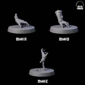 Puede incluir: Tres modelos de manos en miniatura grises sobre bases circulares. El modelo A muestra una mano extendida, el modelo B tiene una mano con un guantelete y el modelo C representa una mano que emerge de una forma retorcida. El texto "Model A", "Model B" y "Model C" está debajo de cada modelo.