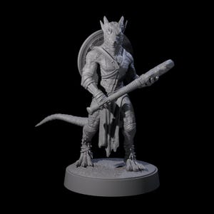 May include: A grey 3D-printed fantasy figure of a reptilian humanoid warrior. The figure is posed with a club in its right hand and a shield on its back. It has a long tail and is standing on a circular base. The figure is detailed with armour and straps.
