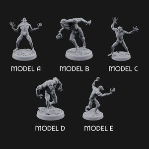 May include: Five gray miniature monster figurines, each on a circular base. The models are labeled A through E, showcasing different poses and designs. The figures have a detailed, textured appearance, with visible muscles and claws.