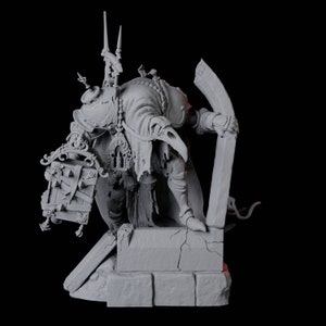 May include: A gray, detailed miniature figurine of a skeletal figure wearing a robe and holding a book. The figure stands on a stone base with a broken tombstone behind it.