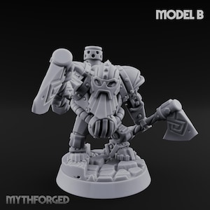 May include: A gray miniature figure of a dwarven warrior, holding a hammer and shield. The figure has a detailed helmet and armor, with the text "MODEL B" and "MYTHFORGED" visible.