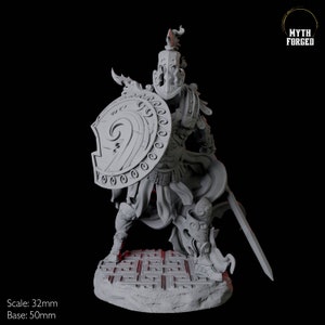 May include: A gray figurine of a warrior in ornate armor, holding a shield and sword. The shield features a spiral design. The base is a stone-like structure with a maze pattern. The text "Myth Forged" is in the upper right corner. Scale: 32mm, Base: 50mm.