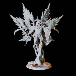 May include: White painted miniature figurine of an angel warrior with large wings, holding a sword and shield, standing on a rocky base.