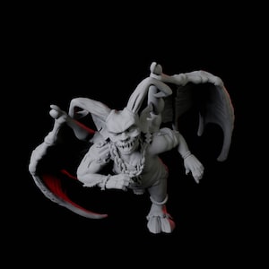 May include: A grey, detailed miniature figurine of a goblin with wings, horns, and a toothy grin. The goblin is wearing a necklace and is holding a weapon.