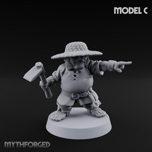 May include: A gray miniature figurine of a dwarf wearing a straw hat and holding a pickaxe. The dwarf is pointing with his right hand. The text "MODEL C" is in the upper right corner. The text "MYTHFORGED" is at the bottom.