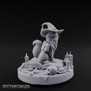 May include: A detailed, grey 3D-printed figurine of a cat wearing a witch's hat and backpack, seated on a book. The base includes candles, a skull, and other magical items. The text "MYTHFORGED" is at the bottom.