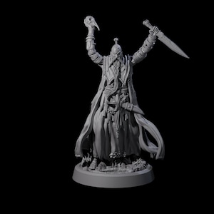 May include: A gray figurine of a robed figure with a long beard, holding a skull and a sword. The figure is standing on a circular base. The figure's arms are raised, and it has a detailed design.