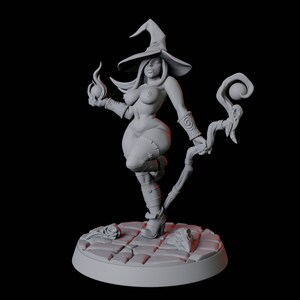 May include: A gray painted miniature figurine of a witch wearing a pointed hat and holding a staff with a skull at the top. The witch is standing on a circular base with a stone-like texture.