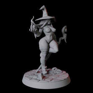 May include: A gray, detailed miniature figurine of a female witch wearing a pointed hat and holding a staff with a glowing orb. The witch is standing on a circular base with a cobblestone design.