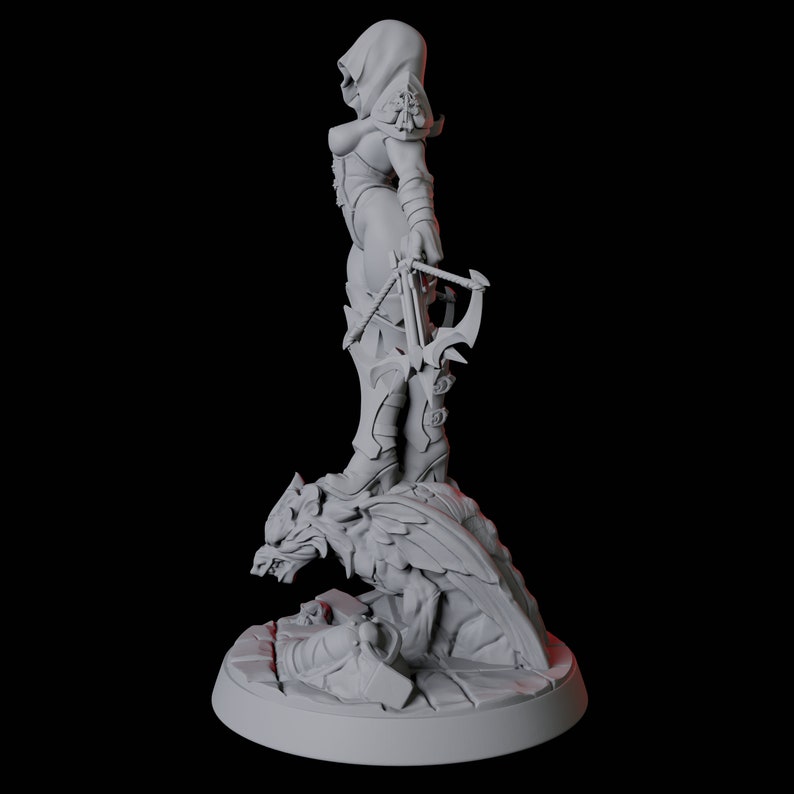 May include: A gray figurine of a hooded figure holding a crossbow, standing on a detailed dragon-like creature. The figure is wearing armor and boots. The base is round and has a stone-like texture.