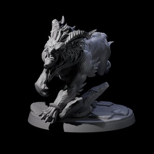 May include: A gray, detailed sculpture of a mythical creature with horns, a lion-like mane, and sharp claws. The beast is in a dynamic pose, as if leaping forward, and is mounted on a circular base with a rocky texture. The background is black.