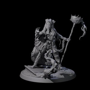 May include: A gray 3D-printed fantasy figure of a robed character with a crown, chains, and a staff. The figure is standing on a circular base with a detailed, textured design. The character has long hair and is holding up one hand.