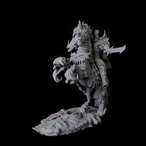 May include: A detailed gray sculpture of a knight on horseback, poised in a dynamic pose. The knight is armored and holds a sword. The horse is also armored, with intricate details. The sculpture rests on a rocky base against a black background.