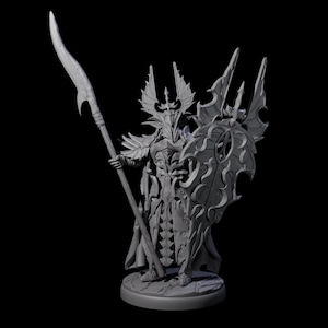May include: A gray, detailed figurine of a warrior in ornate armor, holding a spear and shield. The warrior has a tall, pointed helmet and a flowing cape. The shield has a decorative design. The figurine is on a round base.