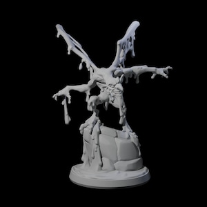 May include: A light grey 3D-printed figurine of a monstrous creature with bat-like wings and a grimacing face. The figure appears to be dripping with a viscous substance. It stands on a rocky base against a black backdrop.