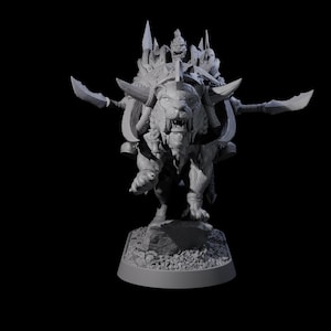 May include: A detailed gray sculpture of a fantasy creature, a lion-like beast with horns and blades, carrying a warrior figure. The sculpture has intricate details and is set against a black background.