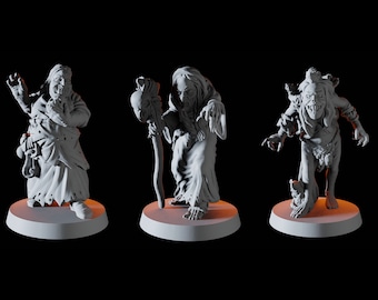 May include: Three gray, detailed figurines of grotesque, zombie-like figures. Each figure stands on a circular base. One figure has a staff, another has a tattered cloak, and the third has a raised arm. The background is black.