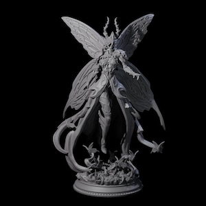 May include: A grey 3D-printed figurine of a winged humanoid figure, possibly a fairy or mythical creature. The figure has large, detailed butterfly-like wings and is standing on a circular base. The overall design is intricate and detailed.
