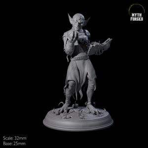 May include: A gray, detailed miniature figurine of a goblin wizard holding a book and a glowing orb. The figurine is standing on a round base with a textured surface. The figurine is 32mm in scale and the base is 25mm in diameter. The figurine is made of a high-quality resin material.