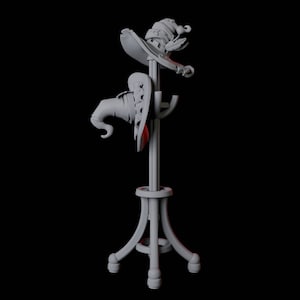 Pode incluir: Um suporte de chapéu de madeira branca com três pernas e uma base redonda. Dois chapéus estão pendurados no suporte, um é um chapéu de bruxa pontudo e o outro é um chapéu mais arredondado com uma aba.