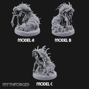 May include: Three grey resin miniature figures labelled Model A, Model B, and Model C. Each creature features a segmented, worm-like lower body, multiple spindly limbs, and sharp dorsal spikes. The figures are displayed on circular bases with the text MYTHFORGED.