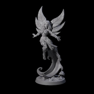 May include: A grey figurine of a fairy with large, leaf-shaped wings, flowing hair, and a flowing garment. The fairy is posed mid-flight, with arms outstretched. The base features a mushroom and other small details.