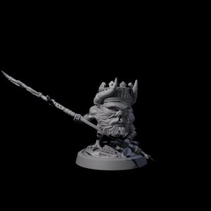 May include: A grey figurine of a crowned, bearded figure holding a spear. The figure has a skull-like face and is wearing a crown with horns. The figurine is on a round base and is set against a black background.