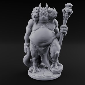 May include: A gray, three-headed fantasy figure with a lion, demon, and dragon head. It holds a staff topped with a skull and wears ornate jewelry and a loincloth. The figure stands on a rocky base.