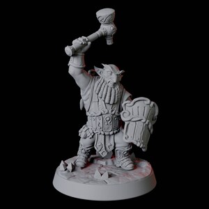 May include: A gray painted miniature figurine of a dwarf warrior holding a hammer and shield. The dwarf is wearing armor and has a beard. The miniature is standing on a round base.