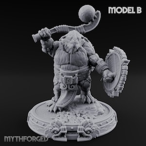 May include: A gray, detailed figurine of a muscular, reptilian humanoid warrior holding a curved weapon with a ball on top and a shield. The figure is on a decorative base with the text "MYTHFORGED" and "MODEL B".