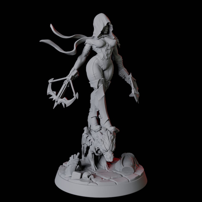 May include: A gray figurine of a female warrior in a hooded cloak, holding a crossbow and a blade. The figure is standing on a detailed base with a monster head and rubble. The statue is a detailed representation of a fantasy character.