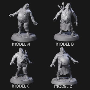 May include: Four gray 3D-printed zombie miniatures, each on a circular base. Model A has a large belly and torn clothing. Model B has arrows on its back. Model C has exposed guts. Model D has a protruding stomach. The text "MODEL A", "MODEL B", "MODEL C", and "MODEL D" are below each miniature.