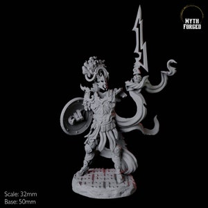 May include: A detailed gray miniature figure of a warrior, holding a shield and a stylized sword. The figure is on a patterned base. The text "Myth Forged" is in the upper right corner. The scale is 32mm, and the base is 50mm.