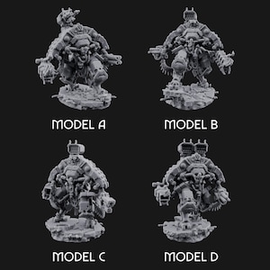 May include: Four gray miniature robot models, labeled A, B, C, and D. Each model is a detailed, mechanical figure with various weapons and attachments, standing on a textured base. The models are designed for tabletop gaming.