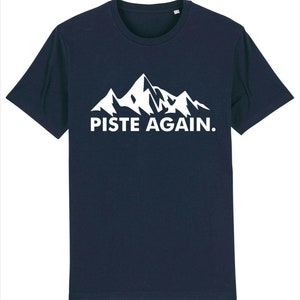 May include: A navy blue t-shirt with a white mountain range graphic and the text "PISTE AGAIN."