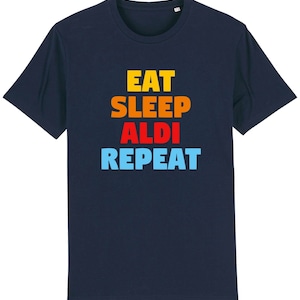 May include: A navy blue t-shirt with the text "Eat Sleep Aldi Repeat" in a rainbow colour scheme.