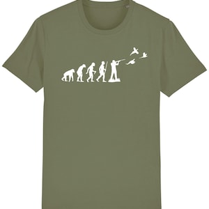May include: A green t-shirt featuring a white graphic of the evolution of man, culminating in a man holding a gun and shooting at flying birds.