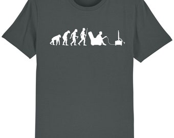 May include: A dark gray t-shirt with a white graphic of the evolution of man, ending with a person sitting in a chair playing video games.