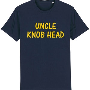 May include: A navy blue t-shirt with the text "UNCLE KNOB HEAD" printed in yellow.